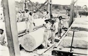 Photograph of convict labor loading granite onto railcars