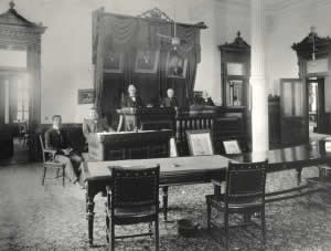 Photograph of men standing in Texas Supreme Court Room