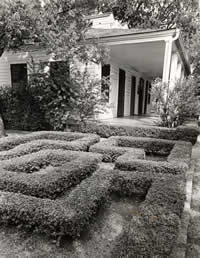 Photograph of manicured hedges on grounds of French Legation Museum