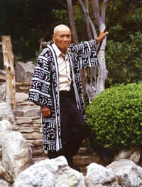 Photograph of Taniguchi in later life wearing kimono outside teahouse