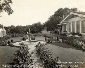 Photograph of the garden with fountain and greenhouse at the Norwood Estate