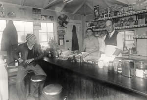 Photograph of interior of cafe showing customer seated at counter