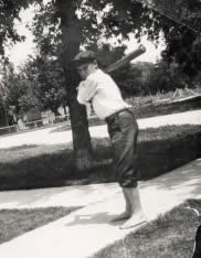 Photograph of boy holding baseball bat