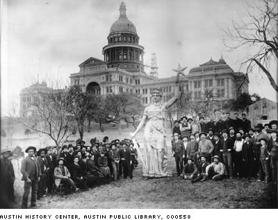 photograph of Goddess with laborers on the lawn in front of capitol. Austin History Center, Austin Public Library, C00558