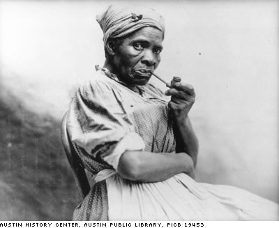 photograph of black woman with pipe. Austin History Center, Austin Public Library, PICB 19453