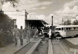 Photograph of U.S. Service men leaving Bowen Bus Station