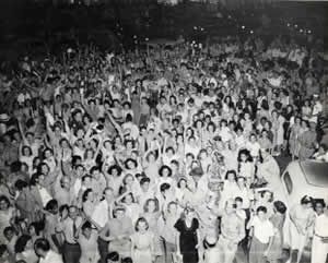 Photograph of very large crowd celebrating V.J. Day downtown