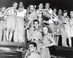 Photograph of group of men and women at a U.S.O. social event