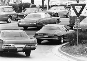 Photograph of cars in intersection of 15th Street and I-35