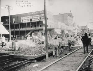 Photograph of workers installing the streetcar rails